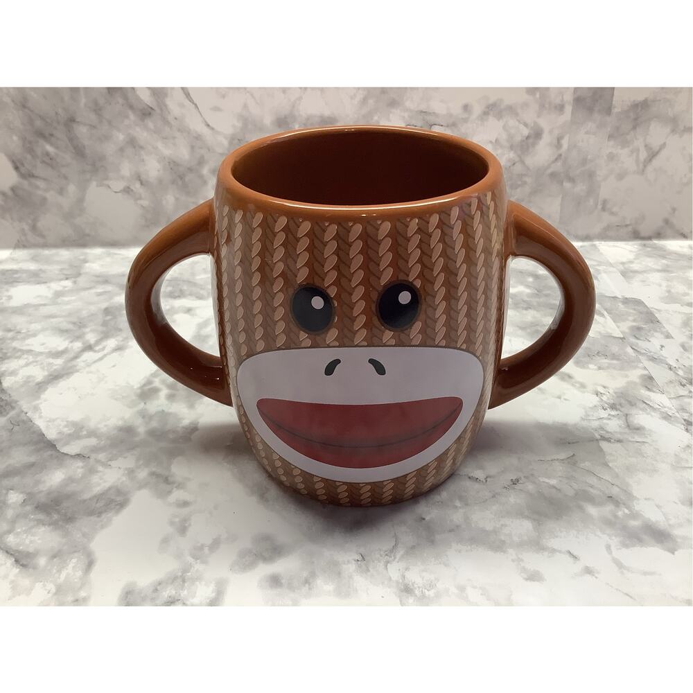 Galerie Brand Ceramic Sock Monkey Mug Featuring Two Handles - 14 oz
